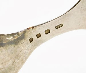 An Arts and Crafts hammered trefoil caddy spoon, by William Thomas Pavitt, London 1913, 9cm long. - 2