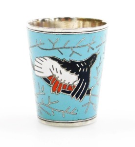 A 20thC Russian white metal and enamel vodka beaker, the enamelled body decorated with a bird and branches on a pale blue ground, impress mark to underside, 5cm high.