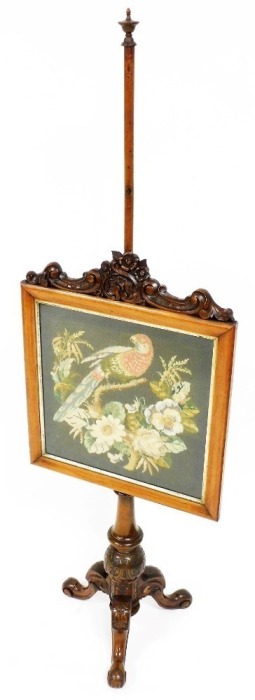 A Victorian walnut pole screen, the square framed panel embroidered with a parrot on branch etc., with a carved leaf column, on tripod base, 161cm high.