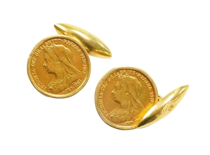 A pair of Victorian half gold sovereign cufflinks, dated 1896, in yellow metal frames, unmarked, 12.7g all in.