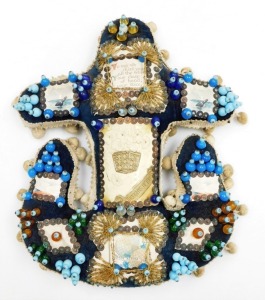 A Hands Across the World naval anchor beaded sweetheart pin cushion, with blue overall design and various applied picture panels and central plaque, with outer cream pom pom detailing, 27cm high, 25cm wide.