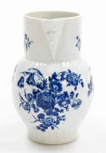 An 18thC first period Worcester porcelain jug, with mask head spout, in the three flowers pattern, with blue and white with crescent mark to underside, 14.5cm high. - 2