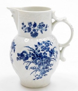 An 18thC first period Worcester porcelain jug, with mask head spout, in the three flowers pattern, with blue and white with crescent mark to underside, 14.5cm high. - 3