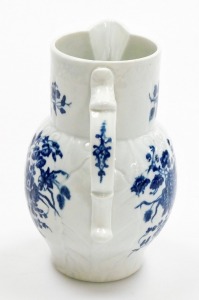 An 18thC first period Worcester porcelain jug, with mask head spout, in the three flowers pattern, with blue and white with crescent mark to underside, 14.5cm high. - 4