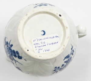 An 18thC first period Worcester porcelain jug, with mask head spout, in the three flowers pattern, with blue and white with crescent mark to underside, 14.5cm high. - 5