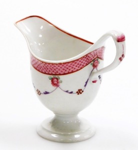 A late 18thC Newhall porcelain helmet shaped cream jug, pattern number 67, with scale border and rose swag design, circa 1780, 10cm high. - 2