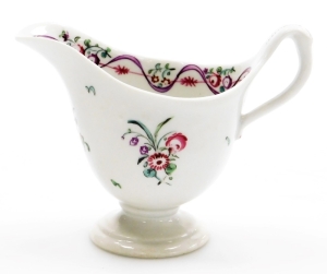 A late 18thC Newhall porcelain helmet shaped cream jug, pattern number 172, with rose spray decoration, 9cm high.