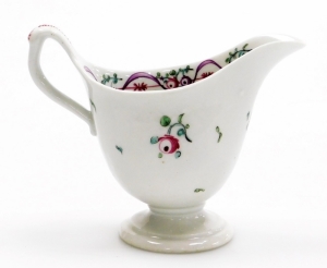 A late 18thC Newhall porcelain helmet shaped cream jug, pattern number 172, with rose spray decoration, 9cm high. - 2