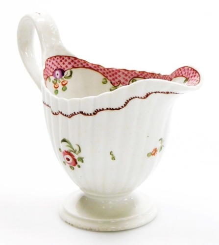 A late 18thC Newhall porcelain fluted cream jug, pattern number 173, with rose band decoration within scale borders, circa 1785, 11.5cm high.