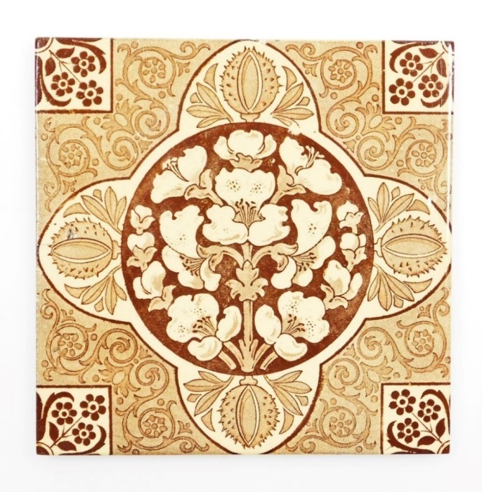 A late 19thC Arts & Crafts wall tile, in brown and sepia tones with conker and floral designs, 15cm x 15cm.