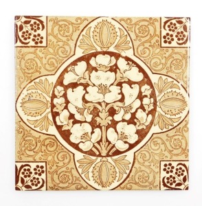 A late 19thC Arts & Crafts wall tile, in brown and sepia tones with conker and floral designs, 15cm x 15cm.