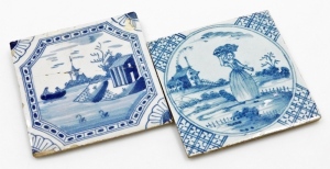 Two English Delft blue and white tiles, an 18thC Liverpool tile depicting ship and lake scene, 12.5cm x 12.5cm, (AF), and a Lambeth Delft plaque with maiden carrying basket, 12.5cm x 12.5cm. (2)