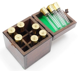 A group of nine novelty Ely shotgun cartridges, converted to storage bottles with plastic tops, in fitted case, together with an additional cheddite shell cased bottle and a pair of Culinary Concepts salt and pepper pots. - 2