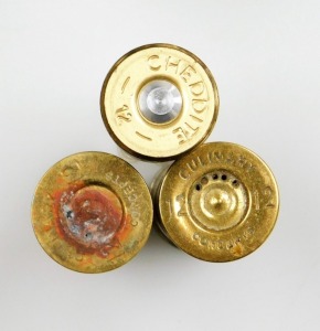 A group of nine novelty Ely shotgun cartridges, converted to storage bottles with plastic tops, in fitted case, together with an additional cheddite shell cased bottle and a pair of Culinary Concepts salt and pepper pots. - 3