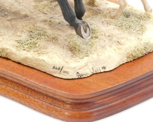 A Border Fine Arts hunting figure group, of a hunter on horseback with horn and two hounds, on a wooden base, 21cm high, 29cm wide. - 3