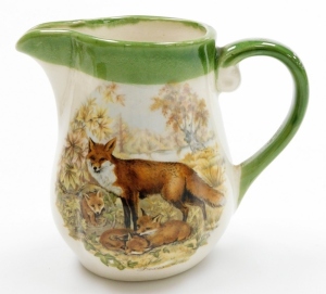 A group of hunting related items, a set of Country Matters coasters, a Crown Staffordshire pin dish, a Present Company pin dish, Hammersley pin dish, fox and fox cub milk jug, and a Coalport Leicestershire plate, limited edition number 98/250. (6) - 7