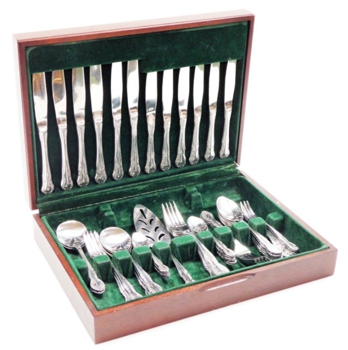 A Richmond stainless steel six piece canteen of cutlery, in mahogany and leather case.