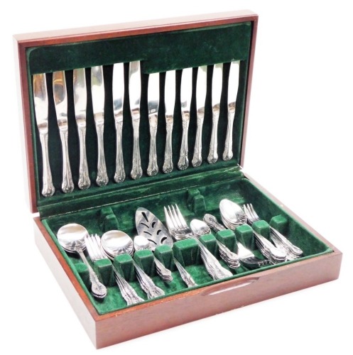 A Richmond stainless steel six piece canteen of cutlery, in mahogany and leather case.
