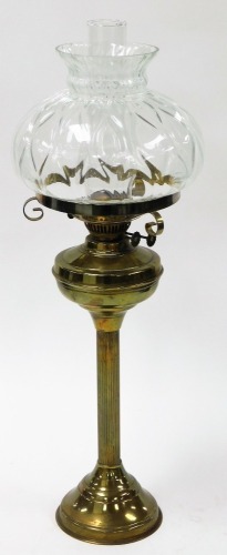 A Victorian style brass oil lamp, with large dome glass top and flute, on reeded column and a stepped base, 72cm high.