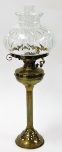 A Victorian style brass oil lamp, with large dome glass top and flute, on reeded column and a stepped base, 72cm high.