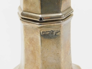 An Edward VII silver sugar castor, with urn shaped finial, pierced sifter and shaped body on a pedestal base, Sheffield 1909, 5&frac34;oz, 21cm high. (AF) - 2
