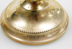 A pair of Elizabeth II silver dwarf candlesticks, of plain form with a beaded border, bases loaded, Birmingham 1967, 7cm high, and a George V silver mounted brush, with bright cut decoration and a moulded scroll border, Chester 1920. - 3