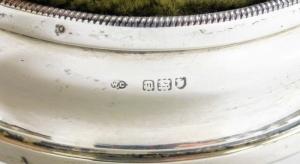 A late 19th/early 20thC silver collared pin cushion, with a sage green corded top, the leather base stamped RD No 520361, hallmarks rubbed, 8cm diameter. - 2
