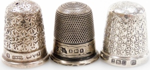 A group of twelve silver thimbles, each of varying design, some in thimble cases, 3&frac12;oz. - 2