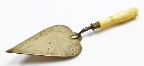 A late 19th/ early 20thC presentation trowel, the plated blade decorated with flowers, scrolls etc., with an ivory handle, 36cm long.