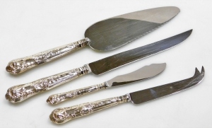 A collection of 20thC silver handled flatware, each with a stainless steel blade, comprising a cake slice, cheese knife, butter knife and a cake knife, each silver handle decorated with flowers, scrolls, shell etc., hallmarks for Sheffield, various dates.