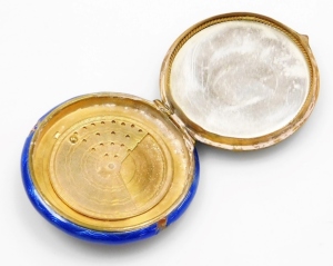 An early 20thC blue guilloche enamel decorated powder compact, with a silver coloured metal flower basket inset to the lid, with an outer plated border, the hinged lid enclosing a mirror back and a gilt metal rotating powder compartment, 5.5cm diameter. ( - 2