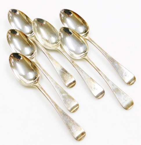 A set of six Victorian silver old English pattern dessert spoons, each with an engraved monogram, makers mark for Henry Holland, London 1865, 10&frac34;oz.