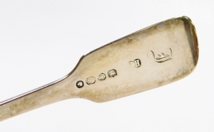 A set of five Victorian silver fiddle pattern forks, London 1859 and 1865, 6&frac34;oz, 17cm long, and a butter knife with a silver blade and mother of pearl handle. (AF) - 2