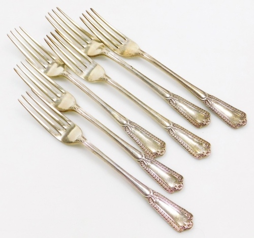 A set of six George V silver table forks, each handle decorated with leaves, flowers, scrolls, etc., makers marks for Elkington and Co, Birmingham 1921, 12&frac34;oz.