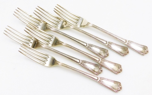 A set of six George V silver dessert forks, each handle decorated with leaves, flowers, scrolls, etc., makers marks for Elkington and Co, Birmingham 1920, 8&frac34;oz.