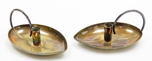 A pair of Elizabeth II silver chamber sticks, of shaped leaf form, makers mark for Geoffrey Guy Bellamy, London 1956, 3&frac34;oz, 11cm wide.