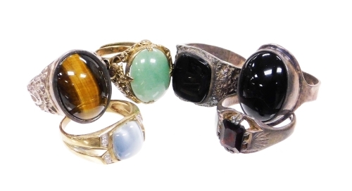 A group of various dress rings, to include four silver and stone set signet rings, gold plated dress ring, and an eastern style silver ring set with imitation jade. (5)