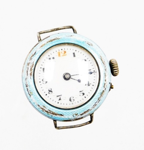 A silver and enamel wristwatch head, the circular watch head with blue enamel outer border (AF) with a white dial with blue handles, in a silver case, Birmingham circa 1920 but hallmarks rubbed, 20g all in.
