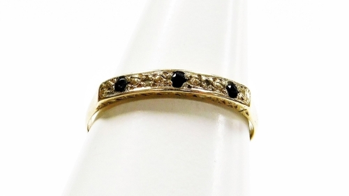 A 9ct gold sapphire and diamond half hoop eternity ring, the stones in platinum setting, on a yellow metal band, ring size O, 1.2g all in.