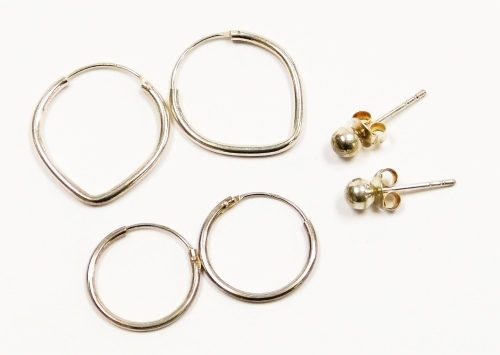 Three pairs of earrings, comprising a pair of studs and two pairs of hoops, white metal, marked 925, 2.3g.