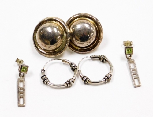 Three pairs of earrings, comprising a pair of stone set drop earrings, Eastern style ball earrings and a pair of hoops, white metal, some marked 925, 14g.