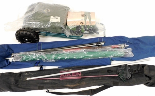 A metal folding fishing trolley, two rod bags and accessories, a Shakespeare all weather suit, and a pair of large wading trousers.