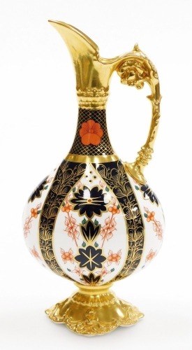 A Royal Crown Derby porcelain Imari pattern ewer, with gilt highlights on a shaped base, red stamp to underside, second, 25cm high.