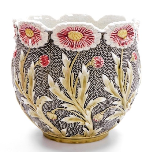 An early 20thC Majolica pottery jardiniere, on a grey ground decorated with Art Nouveau style flowers, etc., impressed mark to underside and numbered 283, 23cm high, 25cm diameter.