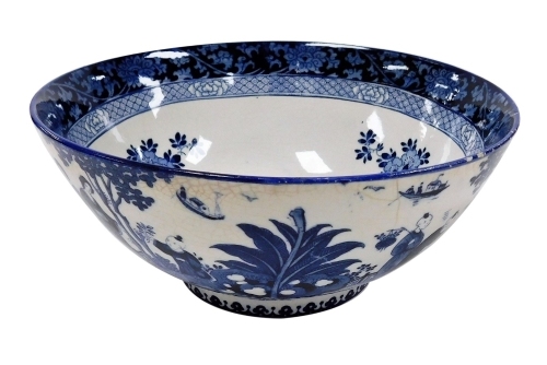 A Booths Silicon ware Ming bowl, in blue and white pattern with Oriental type design and Booth stamp to underside, 22cm diameter. (AF)