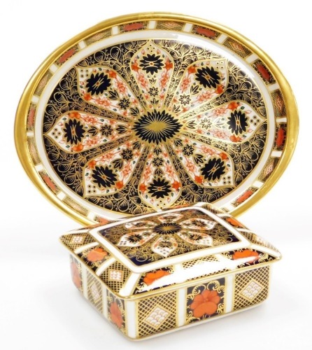 Two items of Royal Crown Derby porcelain Imari pattern wares, to include a rectangular trinket box and cover, 11cm wide, and an oval dish, 19.5cm wide, both with red stamp to underside, second.
