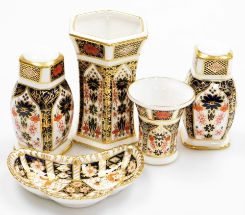 A collection of Royal Crown Derby porcelain Imari pattern items, to include salt and pepper shakers, 10cm high, a crescent shaped pin dish, 11,5cm wide, etc., each with red stamp mark to underside, many seconds.