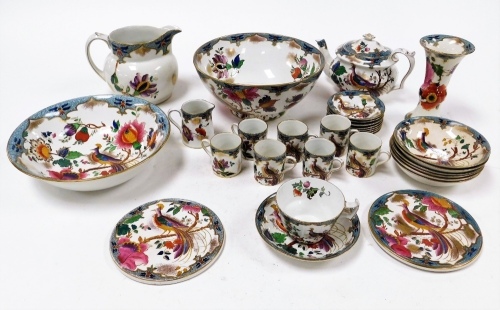 A Booths Lady Amersham's pheasant pattern part service, on a turquoise ground, with gilt detailing of flowers, comprising teapot, teacups, saucers, coffee cans and saucers, large jug, punch bowl, teapot stands, etc. (1 tray)