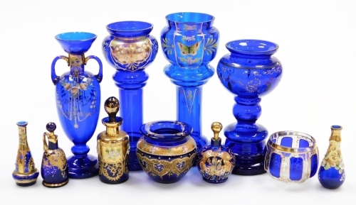 A collection of blue glass, to include a miniature perfume bottle with gilt highlights, two handled vase, 21cm high, etc. (1 tray)