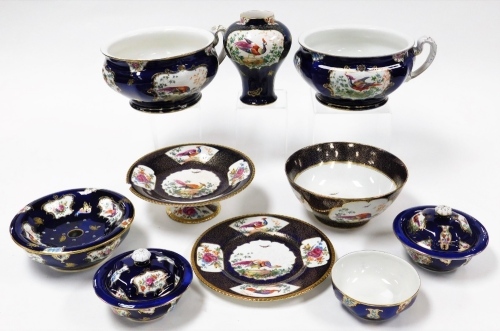 A group of Booths china, each in the Scale Blue pattern with Asiatic pheasant and leaf design picked out in gilt, to include two chamber pots, a vase, two lids, three bowls, two strainers, a punch bowl, cake plate and side plate. (AF)
